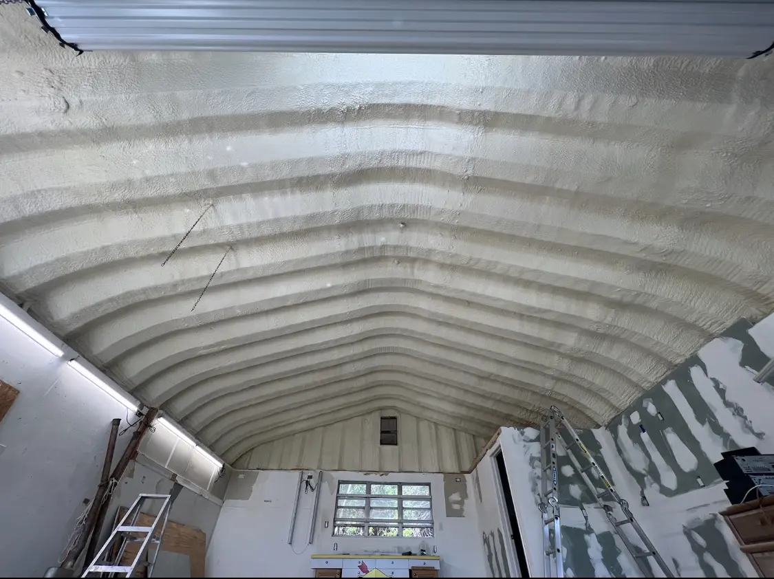 Spray polyurethane foam applied to the underside of a metal roof deck in Bellevue